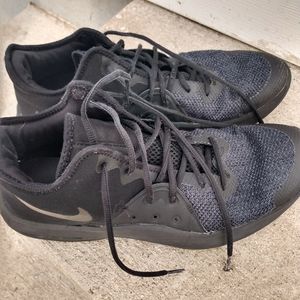 Men's black Nike AIR shoes.